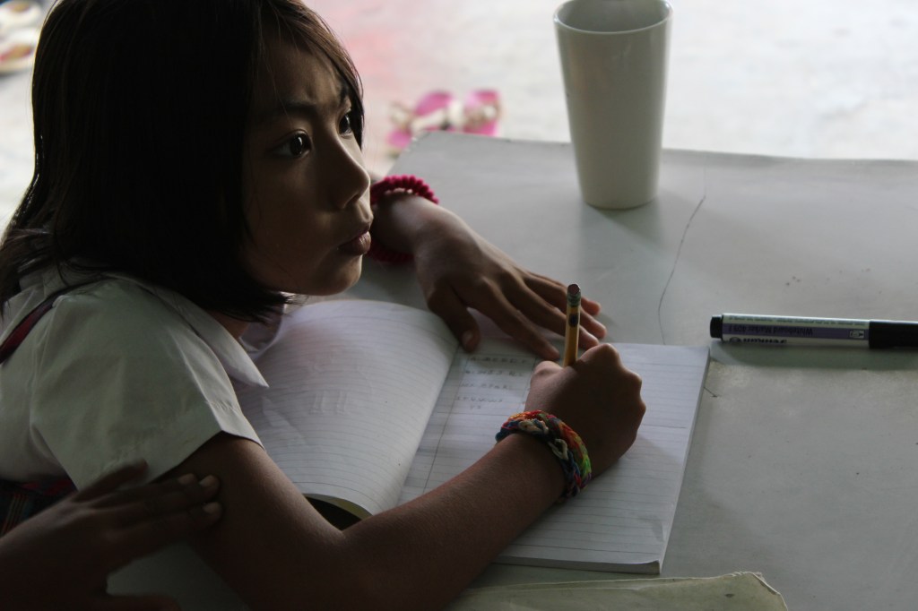 One of the Burmese students working on schoolwork.