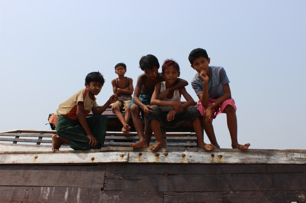 I met these boys at the local beach and spent some time playing with them. Here, they pose on an abandoned ship. 